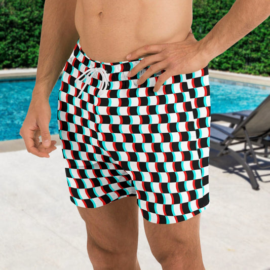 Person wearing a colorful geometric patterned swimsuit by a pool.
