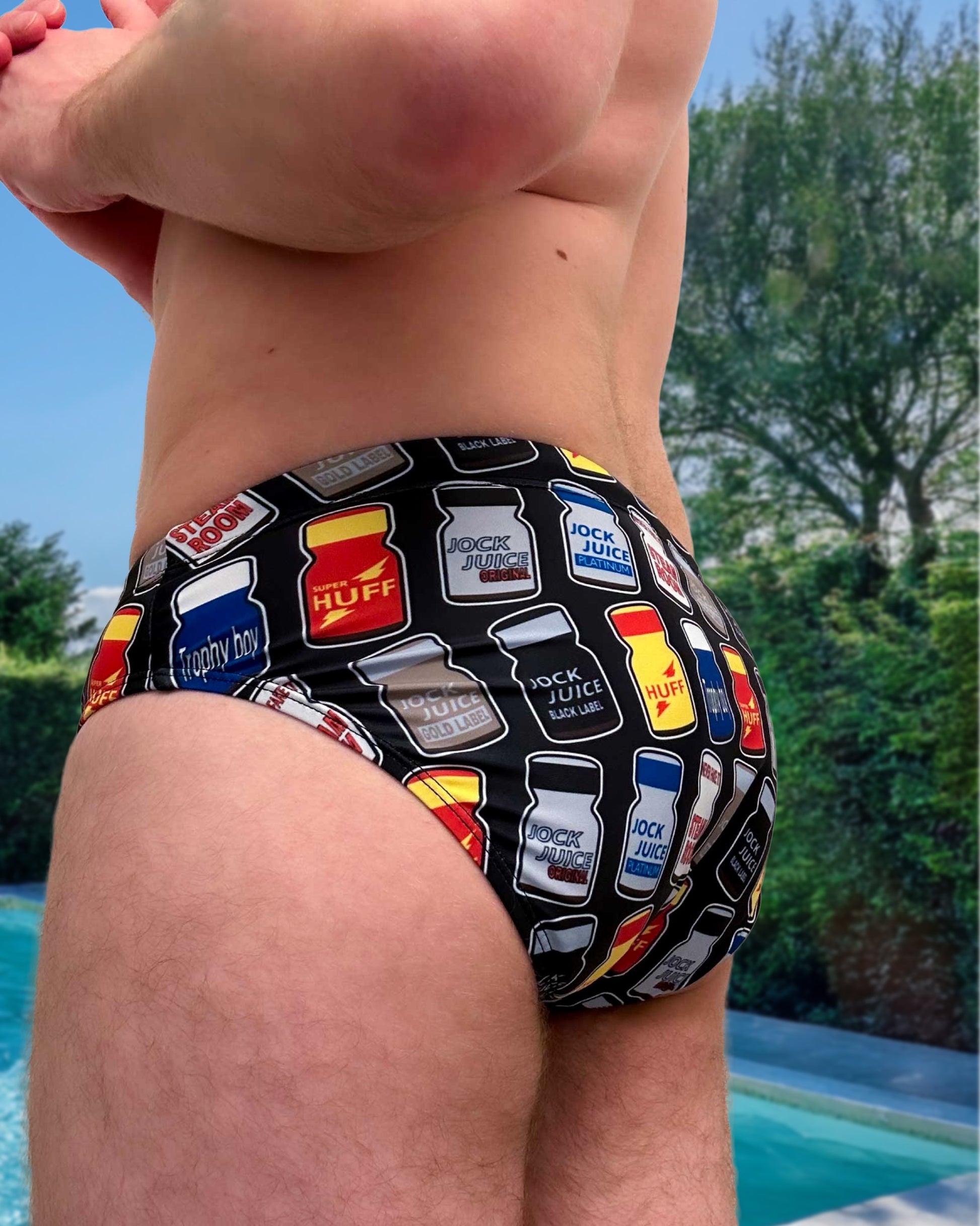 Person wearing a speedo with Poppers Logos, Rush, Jungle Juice, Blue Boy and Locker Room logos for Gay Men Swimwear by Alex Mac