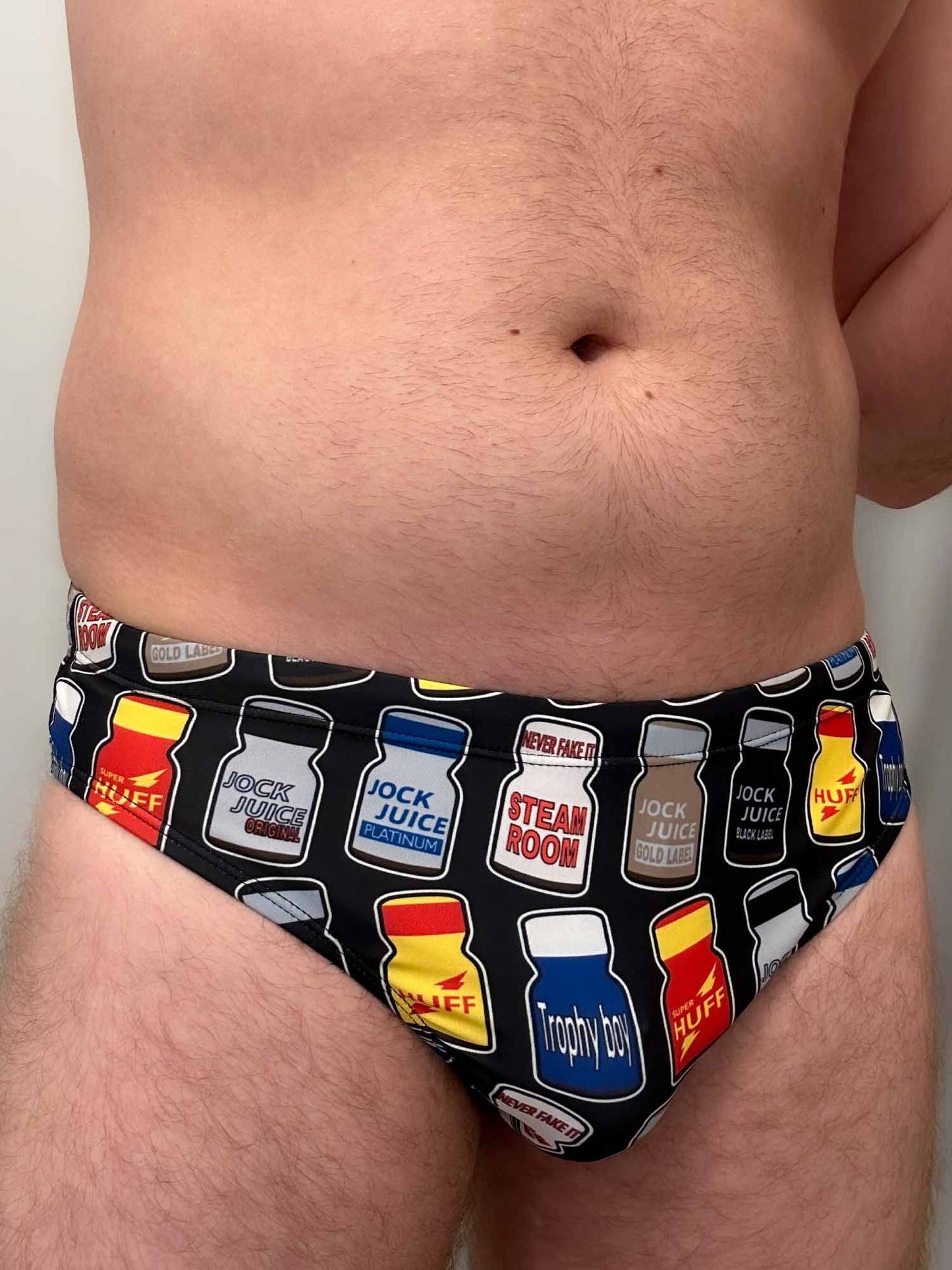 The gay mens Poppers Speedo features drawings of Rush, Double Scorpio, Blue Boy and Jungle Juice popper bottles. They’re  the perfect swim trunks for Pride, Folsom, or even cruising in the dunes at the beach ;)